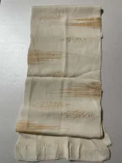 クリーム色　帯揚げ 柔らかいオレンジ色模様