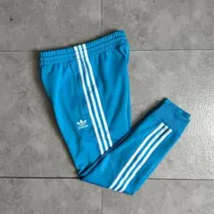 adidas SSTトラックパンツジョガーパンツジ水色三本線トレフォイルロゴ刺繍