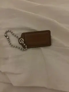 COACH ブラウンレザー タグ型キーホルダー