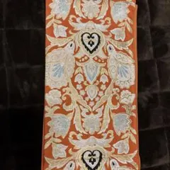 オレンジ色の刺繍入り袋帯
