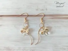 ハンドメイド 運気を整える輝き。クリアな水晶とリボンのエレガントロングピアス