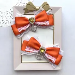 【推し活】オレンジ 白レース ハートビジュー付き リボンヘアクリップ 2個セット