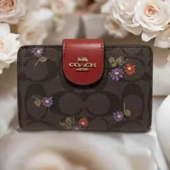 【新品未使用 】COACH 花柄 シグネチャー 二つ折り財布 赤