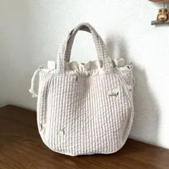 ハンドメイド　ラウンド型巾着ミニトートバッグ　ベージュ　フラワー　ヌビ生地