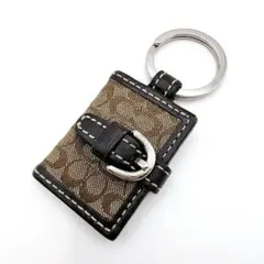 美品 COACH シグネチャー キーホルダー チャーム手帳型 黒 - メルカリ