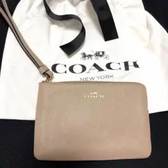 【新品未使用】COACHコーチ　ミニポーチ　ベージュ　あんしん鑑定付き