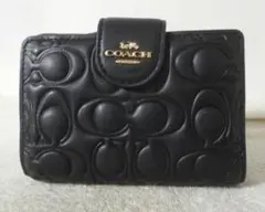 美品】COACH 二つ折り財布 シグネチャー エンボス ブラック - メルカリ