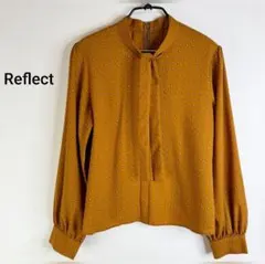 Reflect リフレクト ジオメ柄 ボウタイブラウス パフスリーブ オレンジ