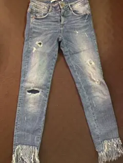 フリンジ付きダメージデニムパンツ