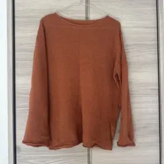 セレクトモカ オレンジ色の長袖ニットトップス