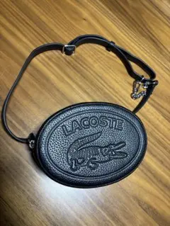 LACOSTE ブラックオーバルショルダーバッグ