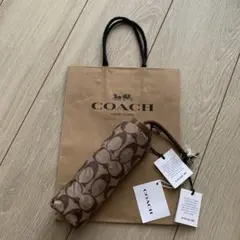 新品未使用 COACH シグネチャー 折りたたみ傘 保存袋付き