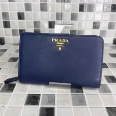 PRADA 長財布 メタルロゴ 折り財布 サフィアーノ フラップ 青 - メルカリ