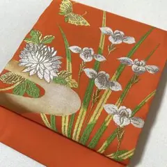 名古屋仕立て　名古屋帯　お太鼓柄　オレンジ　蝶々　花　菊　ゴールド　緑　金のサムネイル