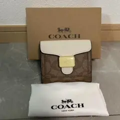新品・未使用】COACH二つ折り財布ブラウン／ホワイト C7805 - メルカリ