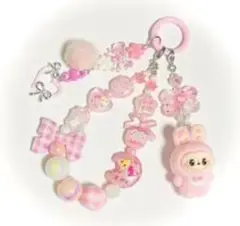 ピンクのキャラクター付き携帯ストラップ