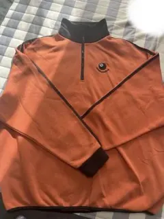 MSGオレンジ ハーフジップトレーナー