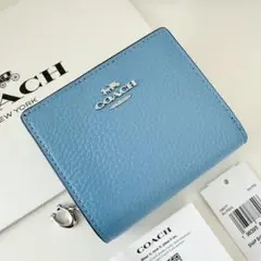 COACH コーチ　折り財布　水色　ブルー　二つ折り財布 COACH コーチ 折り財布 水色 ブルー 二つ折り財布 - メルカリ