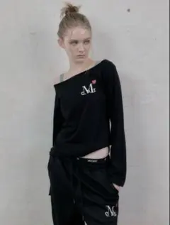 Mucent ムセント ミニハートロゴワンショルダー長袖Tシャツ MUCENT（ムセント）の「ラブリッツミニハートロゴワンショルダー長袖T