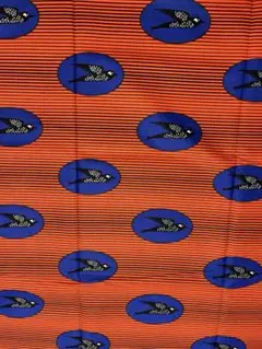 アフリカンプリント　ワックスプリント　アフリカ布　ツバメ　オレンジ色　1ヤード