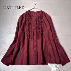 新品タグ付き✨UNTITLED 長袖フリルブラウス ピンタック ノーカラーのサムネイル