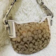 美品」COACH シグネチャー ターンロック アクセサリーポーチ 白 - メルカリ