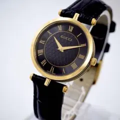 GUCCI 腕時計 黒文字盤 ローマ数字 ゴールドカラー 動作品 F45 - メルカリ
