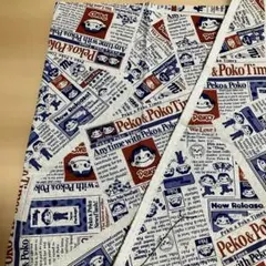 ペコちゃん　ニュースペーパー柄の生地