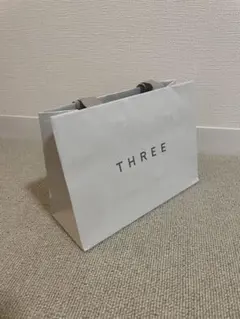 スリー THREE ショッパー 紙袋のサムネイル