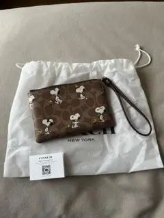 COACH スヌーピー柄 ポーチ 保存袋付き　リストレット