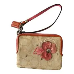 coachフラワーモチーフアップリケリストレットポーチ