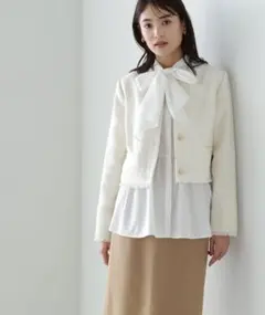 アイボリー ツイードジャケットノーカラージャケット フリンジ仕上げ