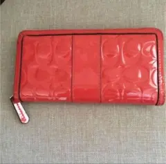Coach エンボス加工 サーモンピンク　長財布