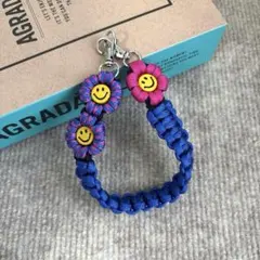 パラコード　ハンドスマホストラップ　☺︎ニコちゃん☺︎ お花　ハンドメイド
