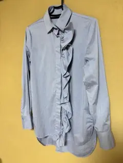 美品✳︎フリル付きライトブルー長袖シャツのサムネイル