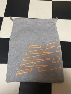 ニューバランス New Balance 巾着 布 オレンジ