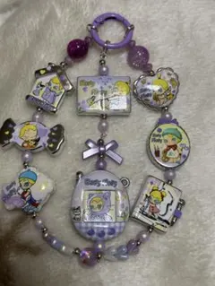 ベイビーモリーのキャラクタープリントビーズ　紫系ストラップ