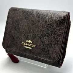 【美品】COACH三つ折り財布シグネチャー PVC×レザーダークブラウン×レッド
