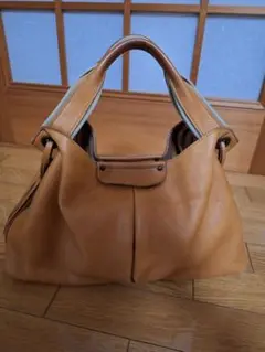 C’omodo+plust レザー ハンドバッグ