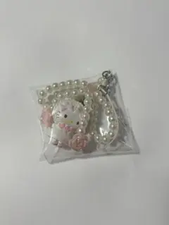 サンリオ　ホワイトフリル　シークレットストラップ　キティ