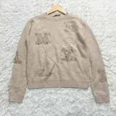 ビジュー付きベージュニットセーター - メルカリ