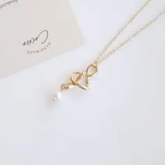 結びチャームとコットンパールのネックレス＊ハンドメイド