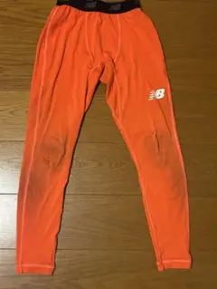 New Balance インナータイツ オレンジ S