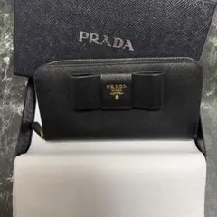 PRADA ブラックレザー 二つ折り財布　リボン PRADA（プラダ） サフィアーノ リボン 二つ折り 長財布 - ブラック