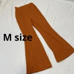 オレンジ カジュアルパンツ