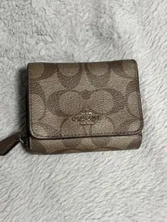 COACH 三つ折り財布 シグネチャー柄