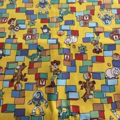 ディズニー生地　トイ・ストーリー　ブロック柄　黄色　オックス生地　ハンドメイド
