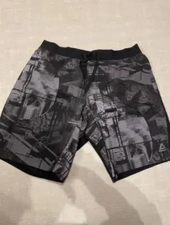reebok グレー黒抽象デザインショートパンツ スポーツウェア　XOサイズ