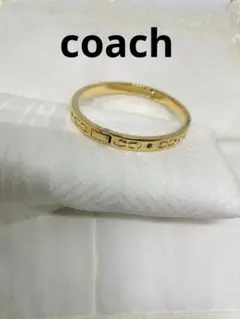 COACH ゴールドカラー バングル ブレスレット　専用袋付きのサムネイル