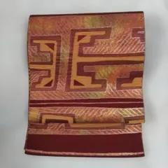 601-21　開き仕立て名古屋帯　作り帯に変更可能　葡萄茶　幾何学模様 　光沢